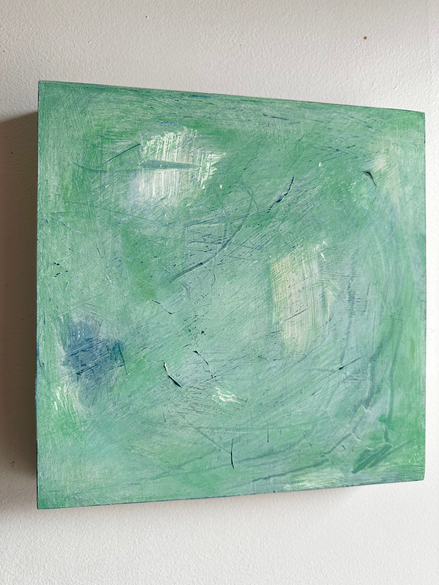 Green and White Abstract on Board